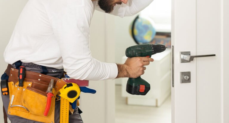 Man installing door security on a door in Pam Rumley's World