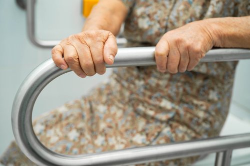 Close-up of bathroom safety bar near toilet for support and stability