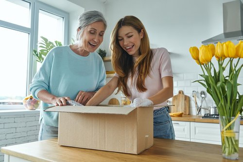 Mother and daughter sorting belongings together during downsizing and relocation